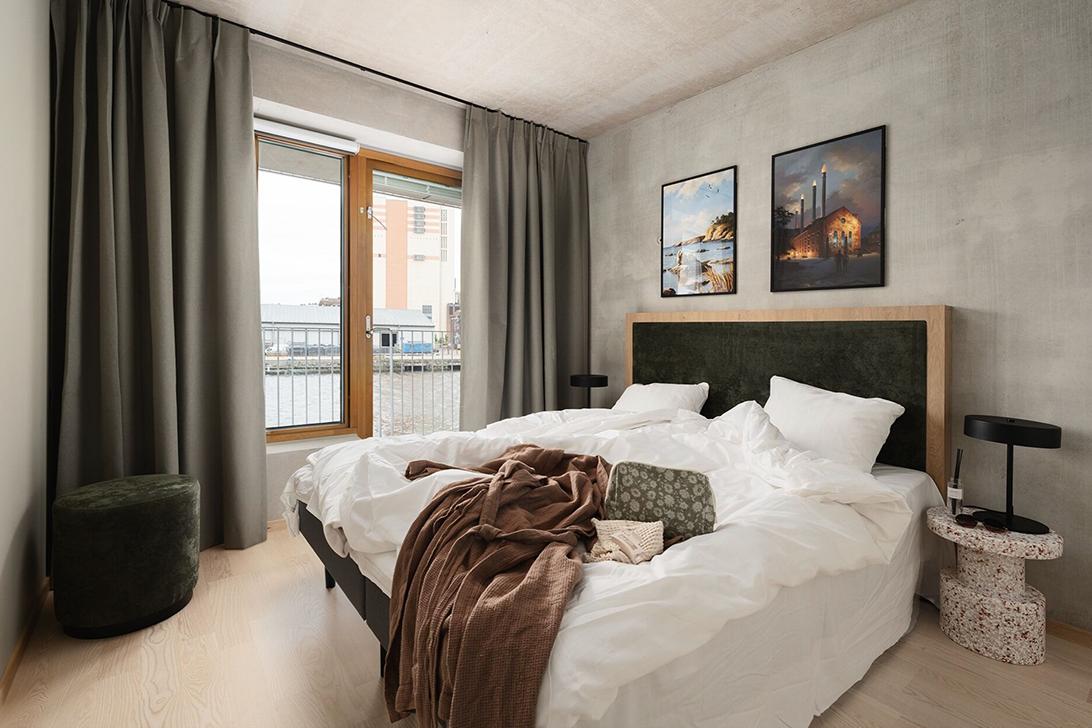 Bedroom with balcony view in an apartment at Vander Inre Hamnen, Norrköping
