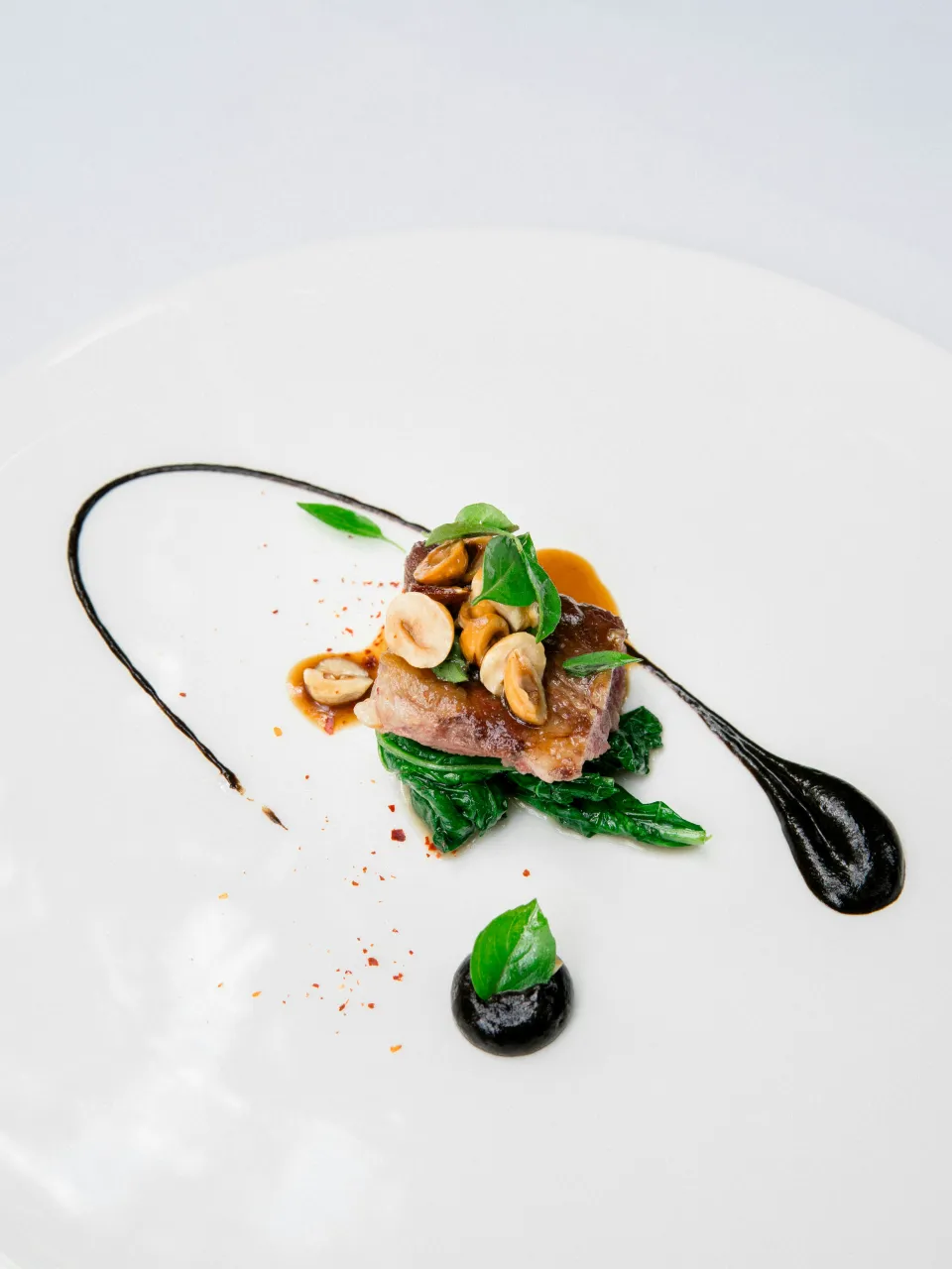 Modern Nordic fine dining dish served on a minimalist white plate