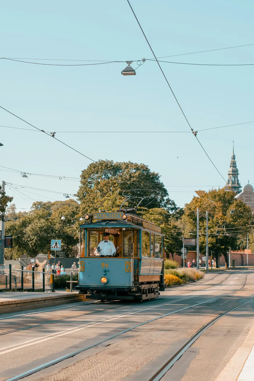 Historic tram on Djurgården in Stockholm surrounded by greenery