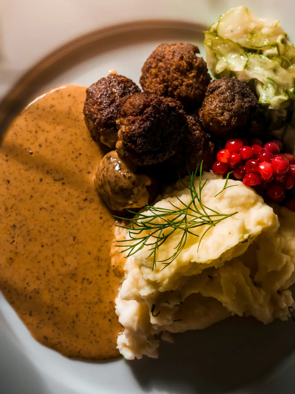 Traditional Swedish meatballs with sauce and potatoes served in Stockholm