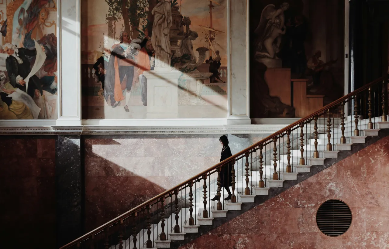 Elegant museum interior with staircase and classical artwork in Stockholm